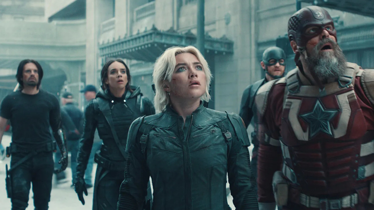 A group of Marvel's Thunderbolts characters—Bucky Barnes, Ghost, Yelena Belova, U.S. Agent, and Red Guardian—stand together in a tense moment on a city street, all looking upward with determined and concerned expressions.